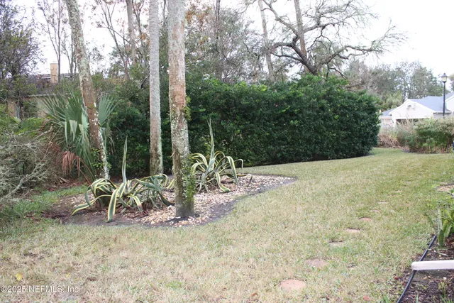 a view of a yard with patio