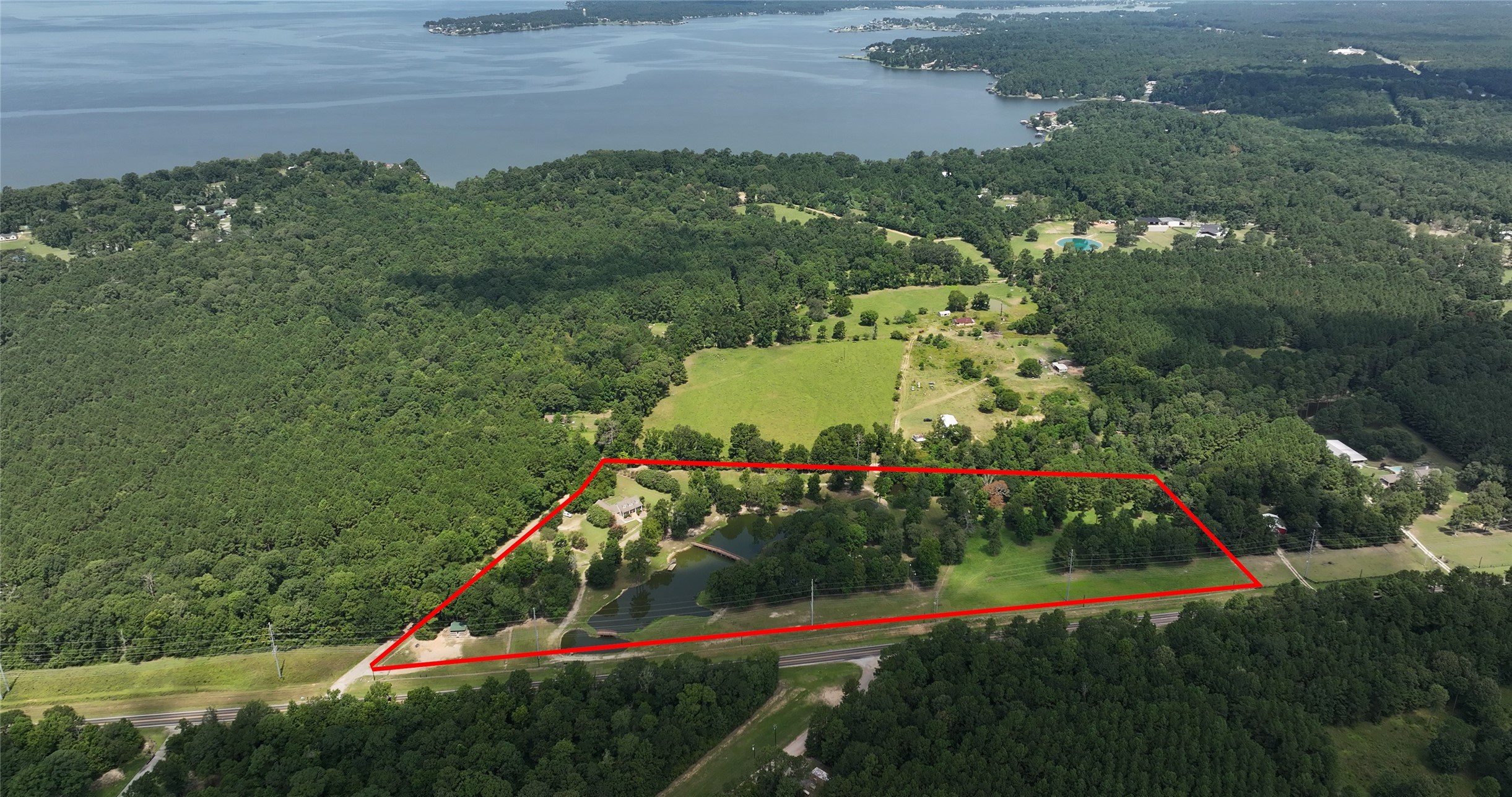 a view of a house with a yard and potted plants