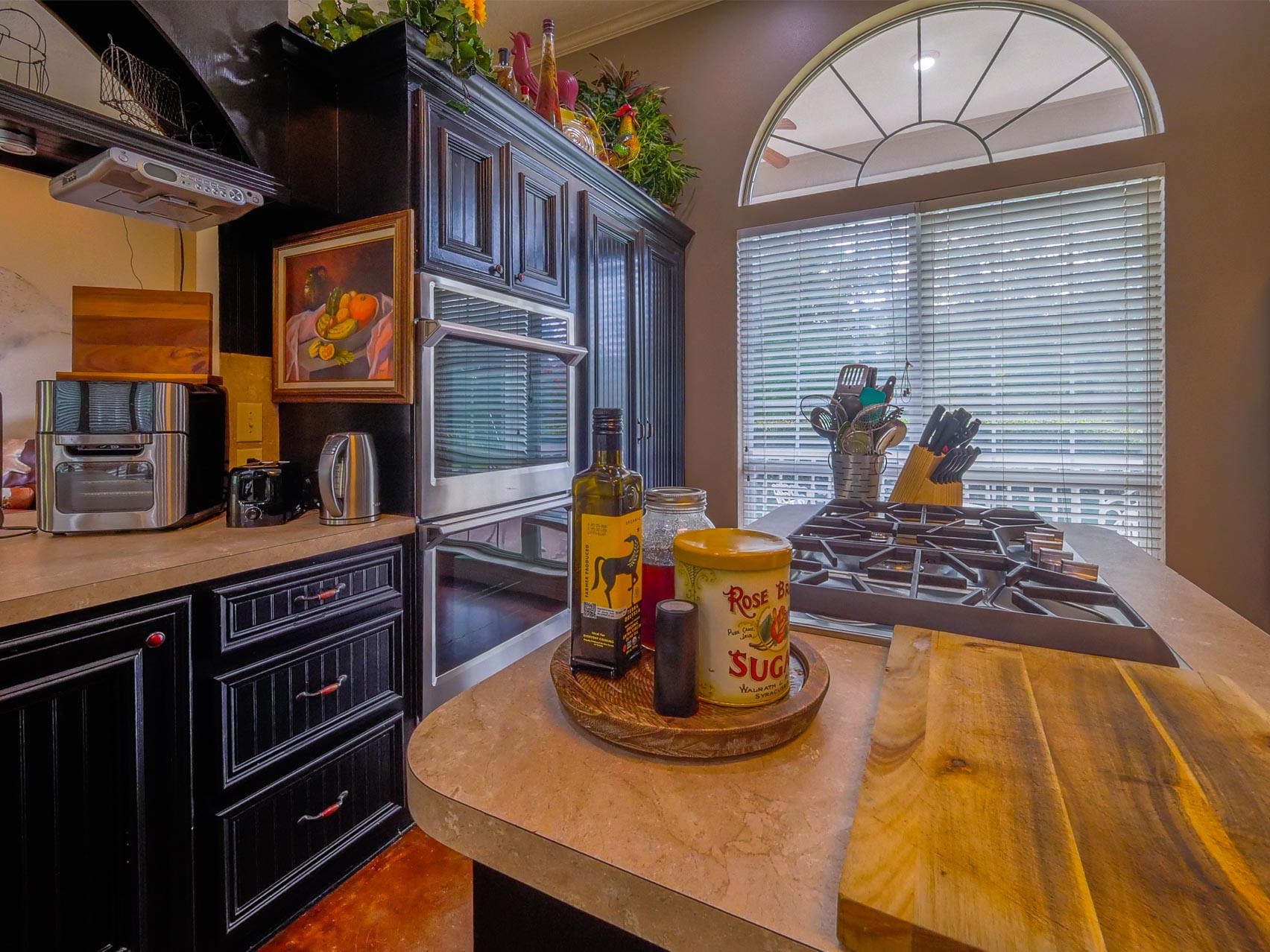 202 Jack White Road Livingston, TX 77351 - Photo 15 of 20 a kitchen with a stove and a wooden cabinets
