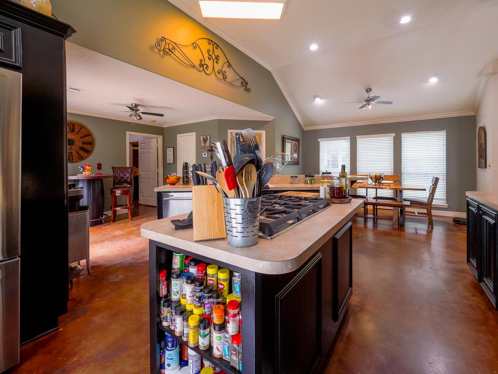 202 Jack White Road Livingston, TX 77351 - Photo 20 of 20 a kitchen with stainless steel appliances granite countertop a stove refrigerator and a dining table with wooden floor