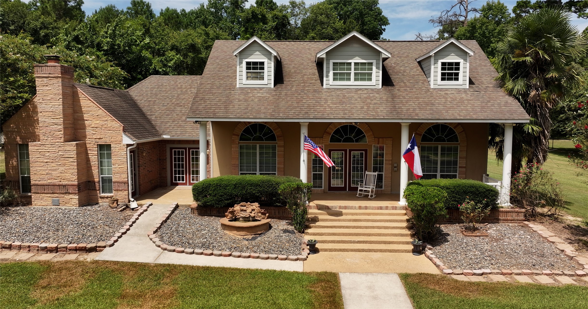202 Jack White Road Livingston, TX 77351 - Photo 2 of 20 a front view of a house with garden