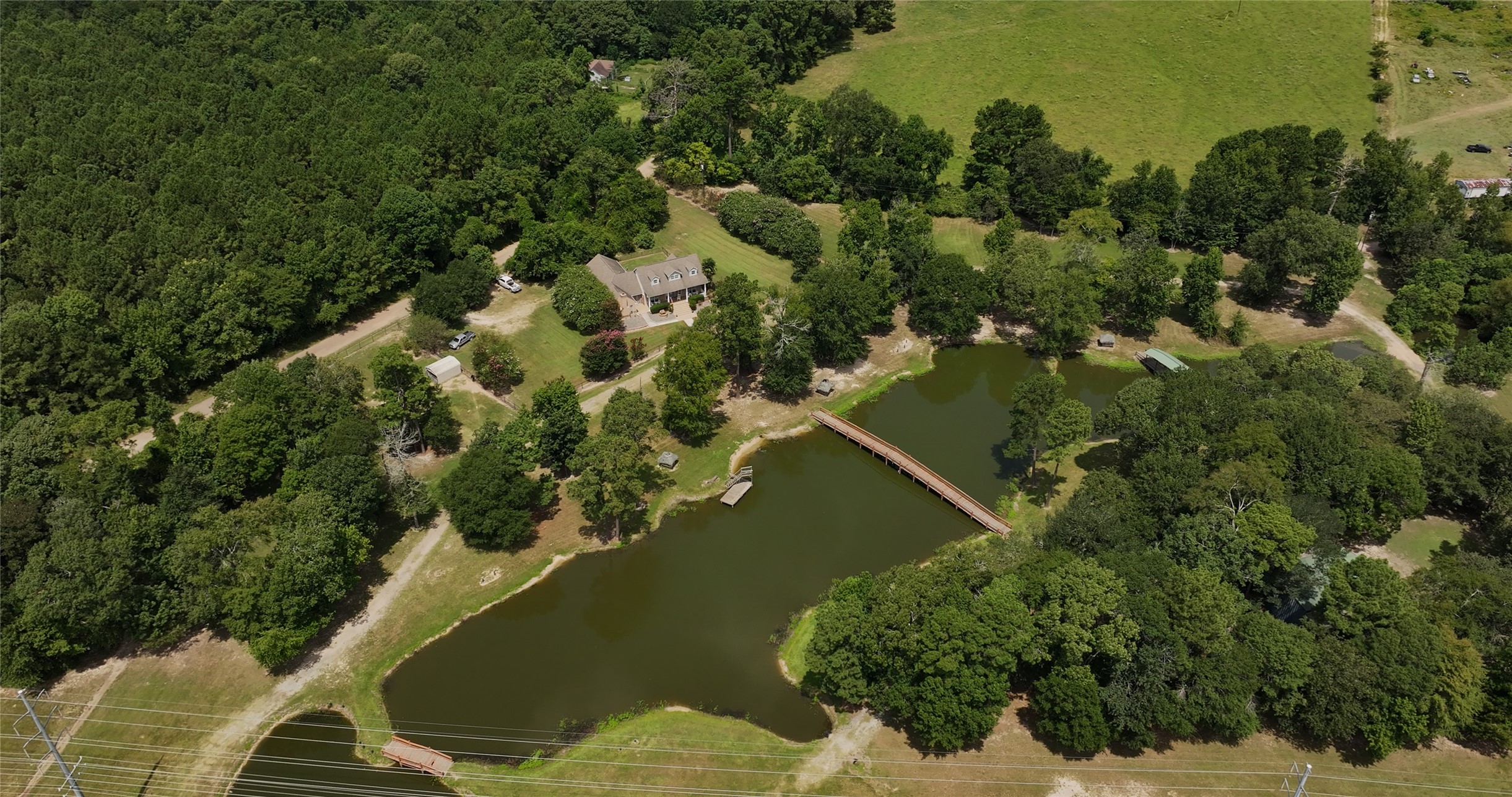 202 Jack White Road Livingston, TX 77351 - Photo 5 of 20 an aerial view of a house with a yard and lake view