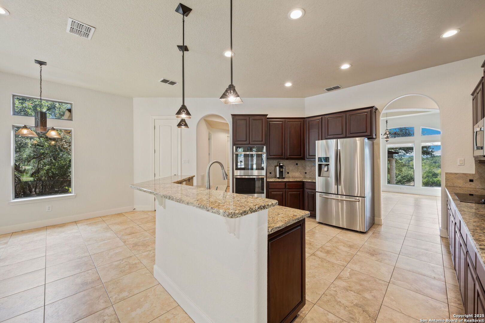3015 River Way Spring Branch, TX 78070 - Photo 16 of 44 a kitchen with refrigerator cabinets and a counter top