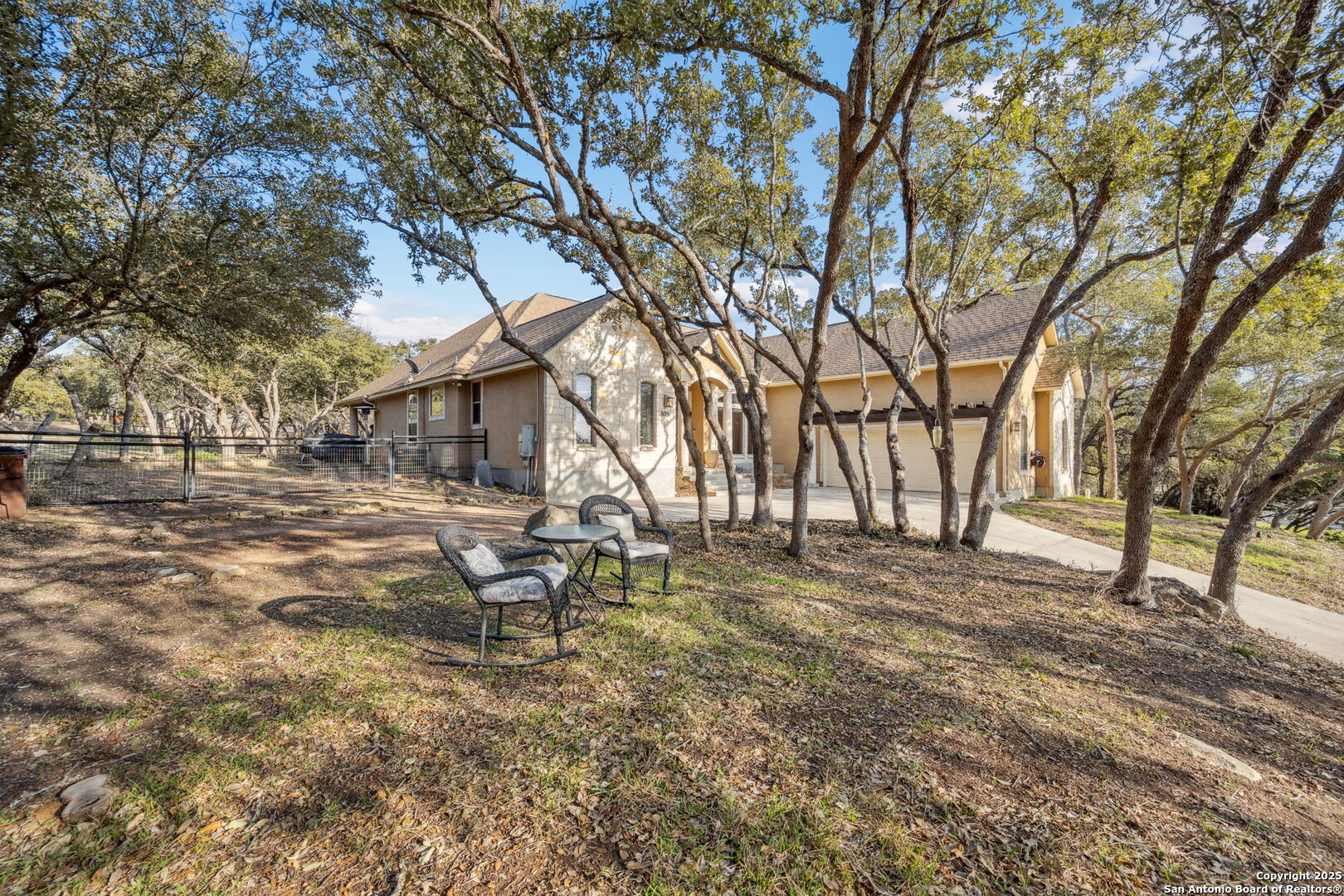 3015 River Way Spring Branch, TX 78070 - Photo 2 of 44 a view of a yard with a tree