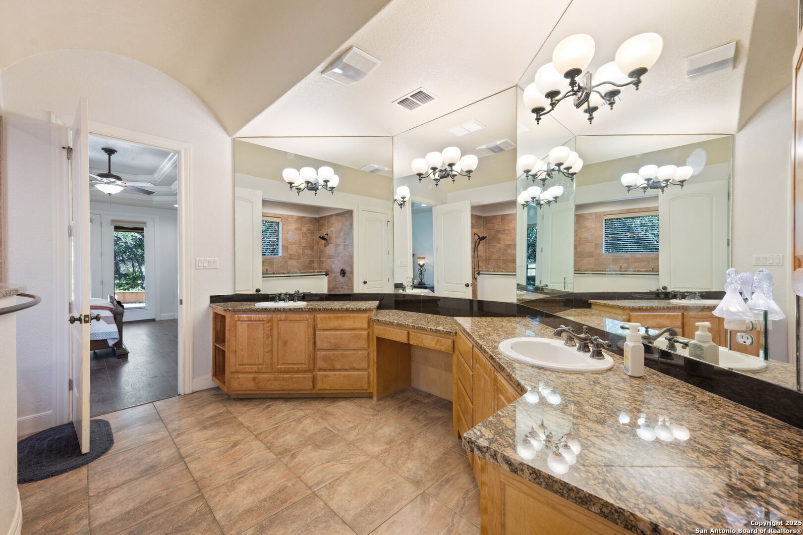 3015 River Way Spring Branch, TX 78070 - Photo 23 of 44 a large bathroom with a sink a large mirror and a shower