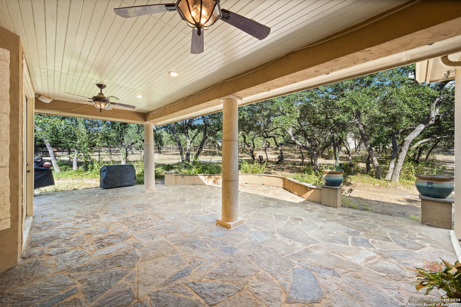 3015 River Way Spring Branch, TX 78070 - Photo 33 of 44 a view of a porch with chairs and backyard of the house