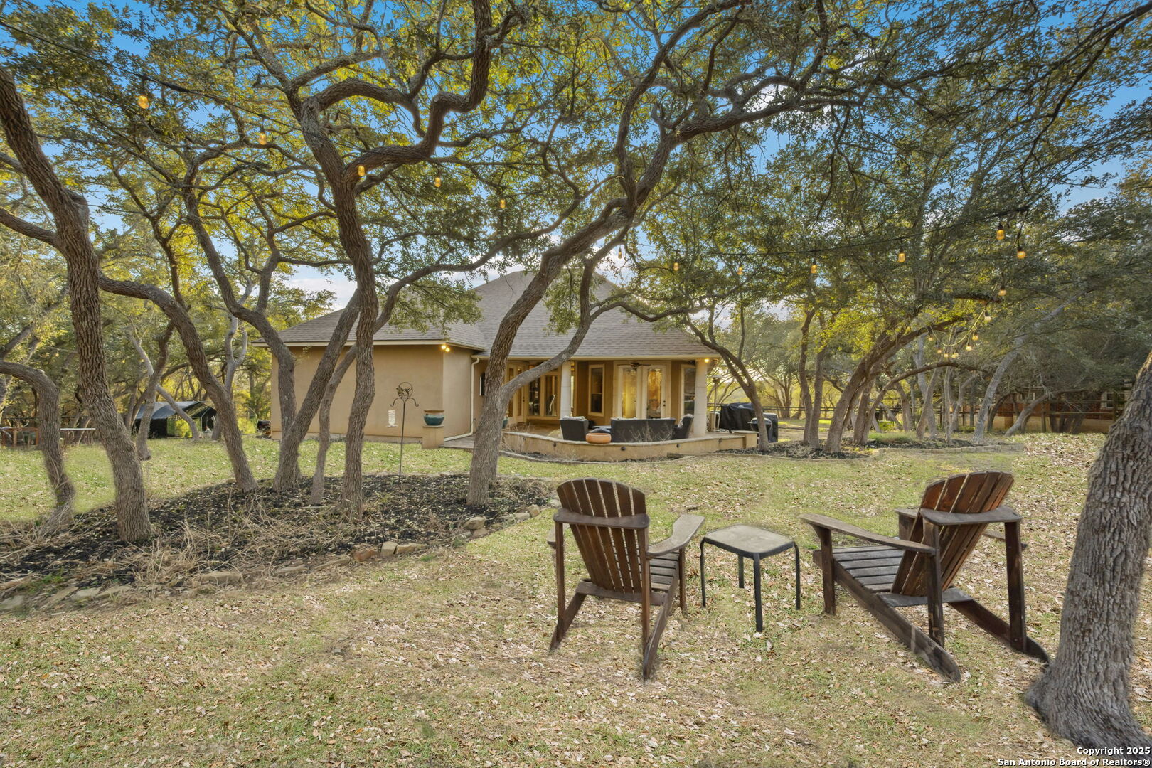 3015 River Way Spring Branch, TX 78070 - Photo 37 of 44 a view of a house with backyard and sitting area