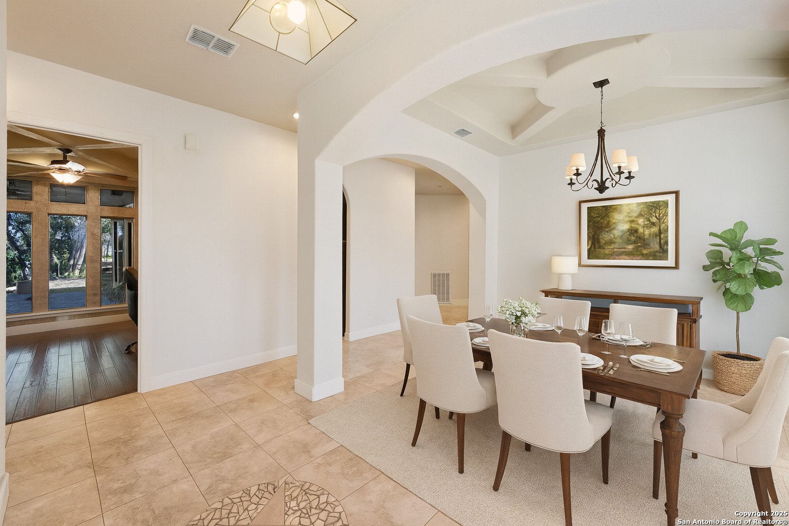 3015 River Way Spring Branch, TX 78070 - Photo 6 of 44 a dining room with furniture a chandelier and wooden floor