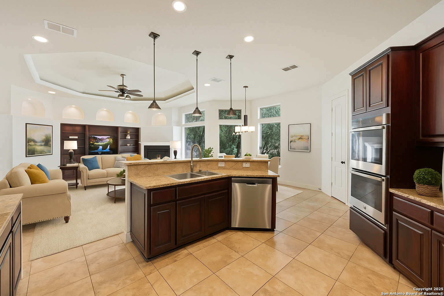 3015 River Way Spring Branch, TX 78070 - Photo 9 of 44 a kitchen with stainless steel appliances kitchen island granite countertop a stove and a sink