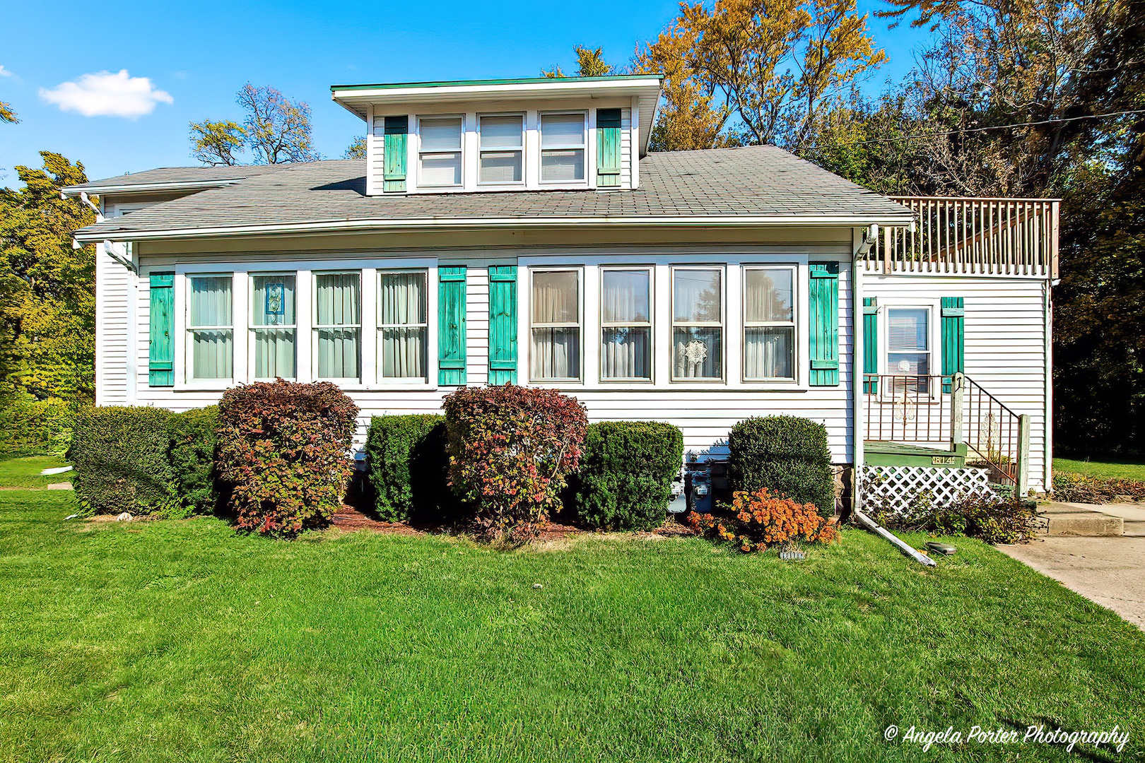 814 North River Road McHenry, IL 60051 - Photo 1 of 39 a front view of a house with a yard table and chairs