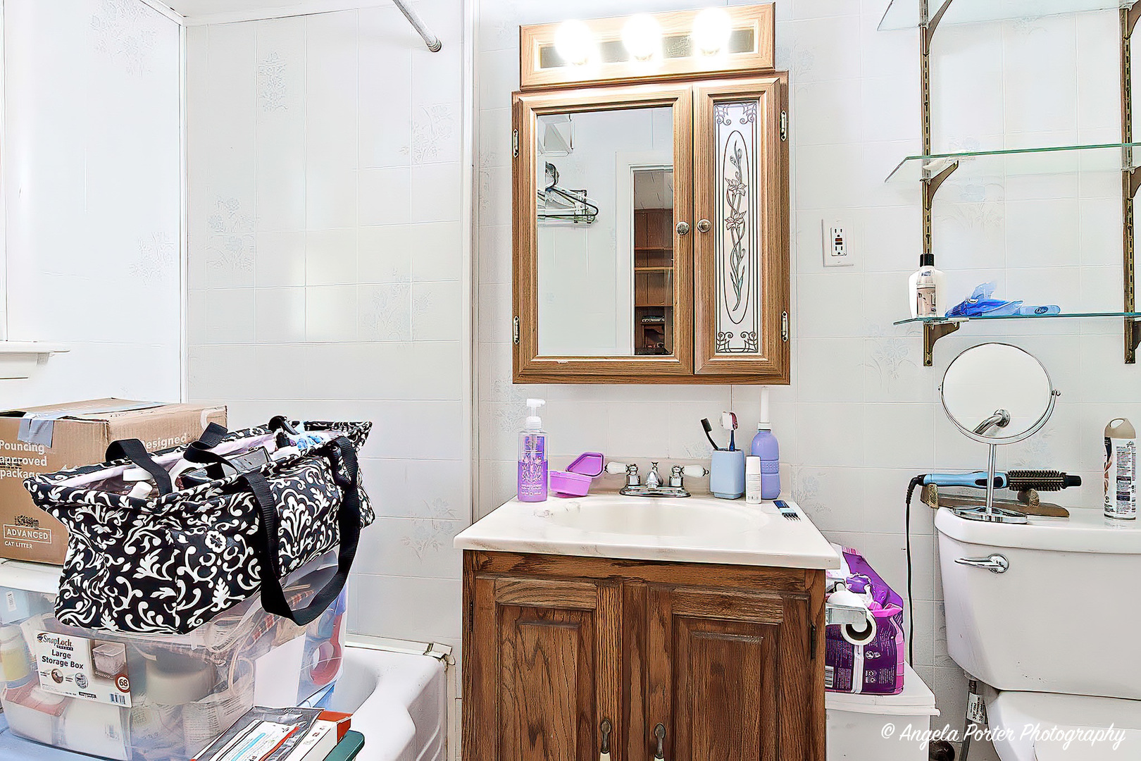814 North River Road McHenry, IL 60051 - Photo 12 of 39 a bathroom with a sink and a mirror