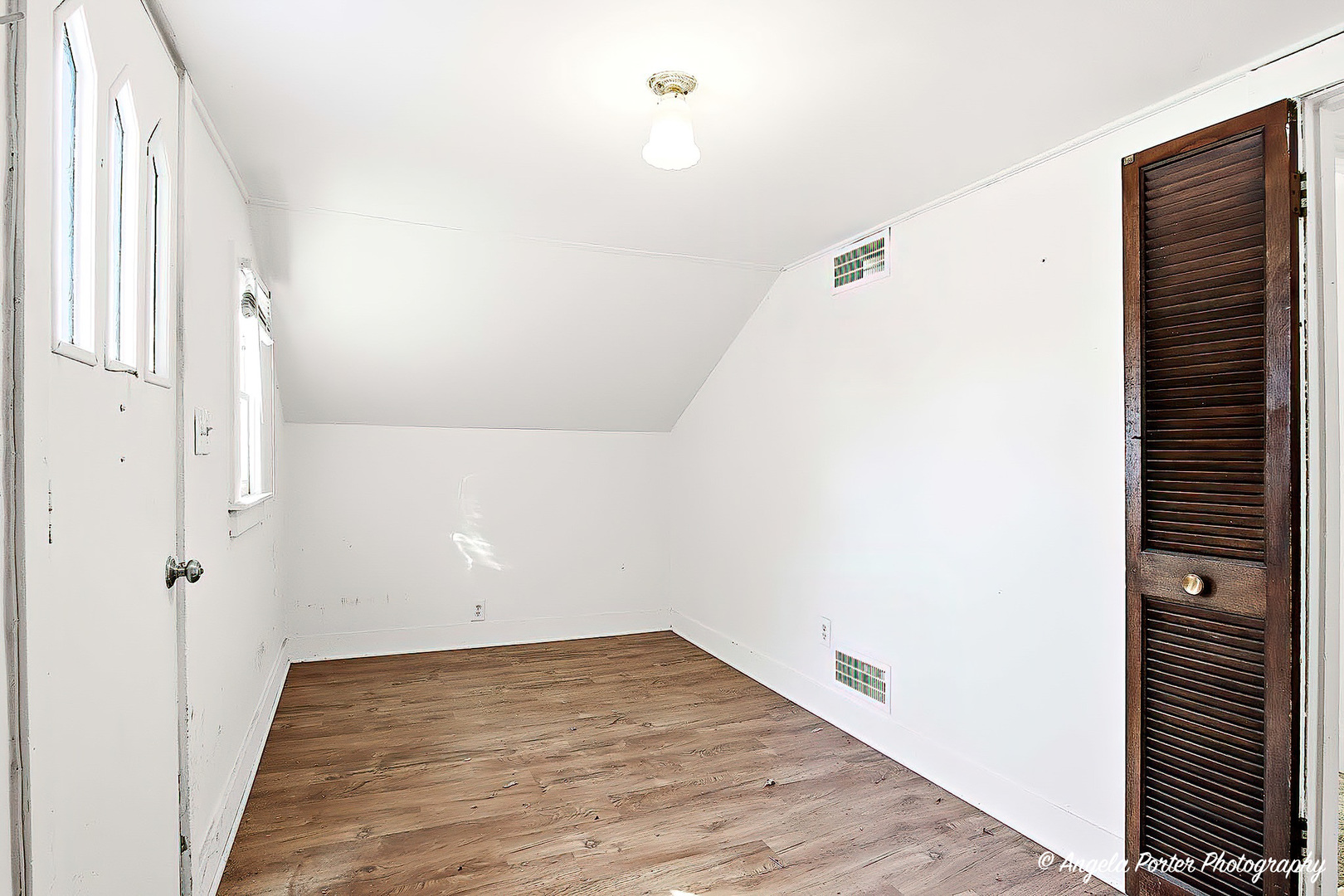 814 North River Road McHenry, IL 60051 - Photo 22 of 39 a view of a room with wooden floor and white walls