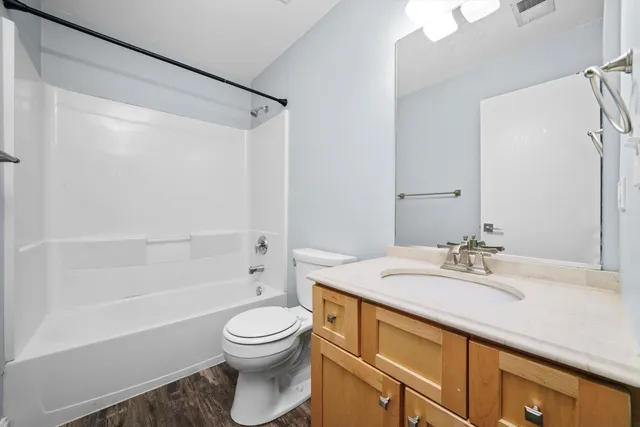 a bathroom with a sink a toilet and a bathtub