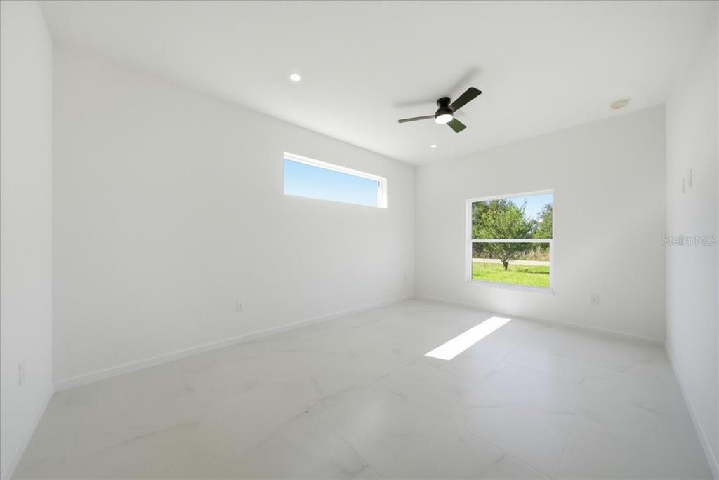 3174 North Sedgewick Road Avon Park, FL 33825 - Photo 8 of 12 an empty room with windows