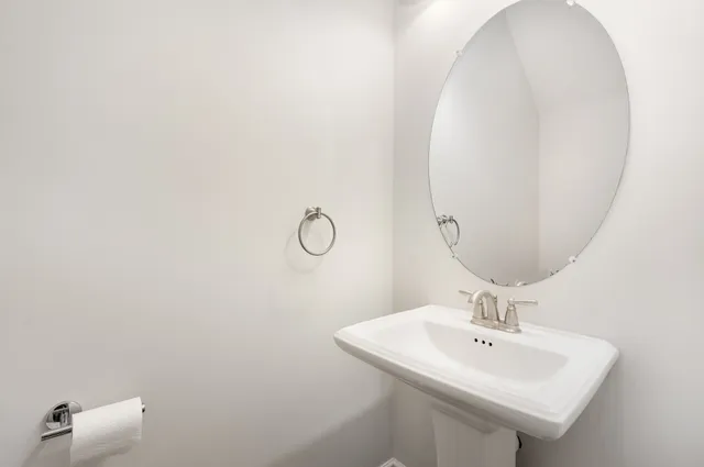 a bedroom with a bed and a potted plant