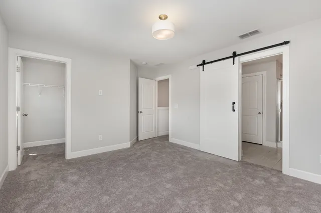 a bathroom with a granite countertop sink a toilet and a bathtub