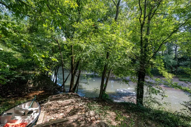 a view of entryway and gallery with wooden floor