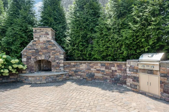 a kitchen with a refrigerator sink and cabinets