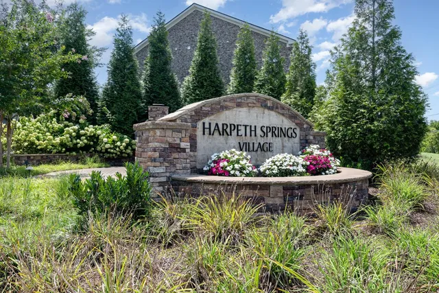 a kitchen with stainless steel appliances granite countertop a refrigerator sink and cabinets