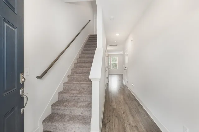 a kitchen with stainless steel appliances granite countertop a sink stove and microwave