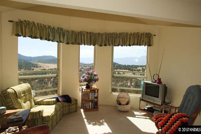 1991 Saddleback Road Reno, NV 89521 - Photo 8 of 13 a living room with furniture and a floor to ceiling window
