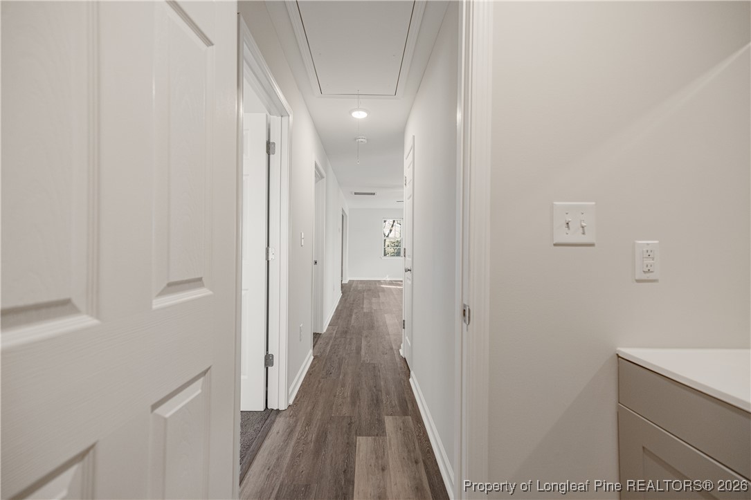 804 Porter Road Hope Mills, NC 28348 - Photo 35 of 42 a view of a hallway with wooden floor