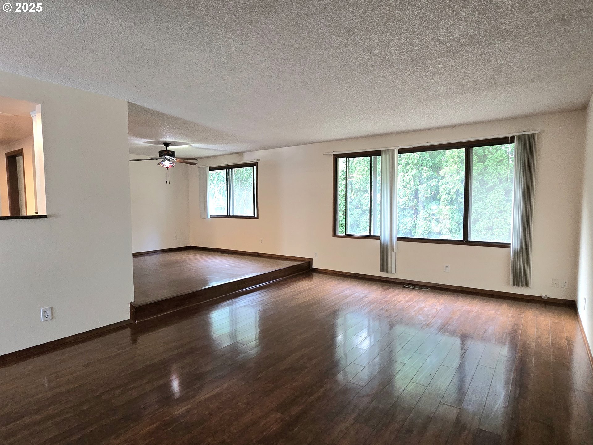 20675 Southwest Rosa Drive Beaverton, OR 97078 - Photo 14 of 40 a view of a livingroom with wooden floor and window
