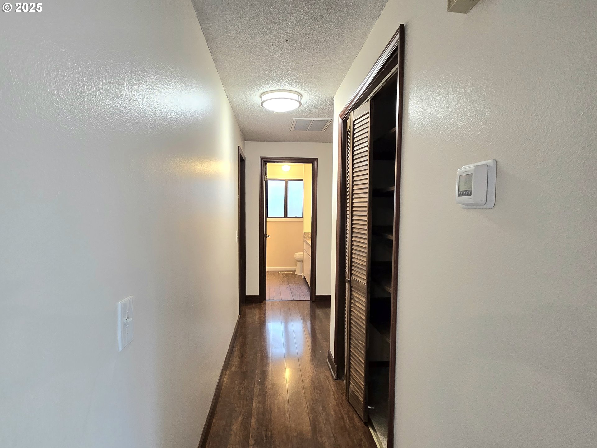 20675 Southwest Rosa Drive Beaverton, OR 97078 - Photo 17 of 40 a view of hallway with wooden floor