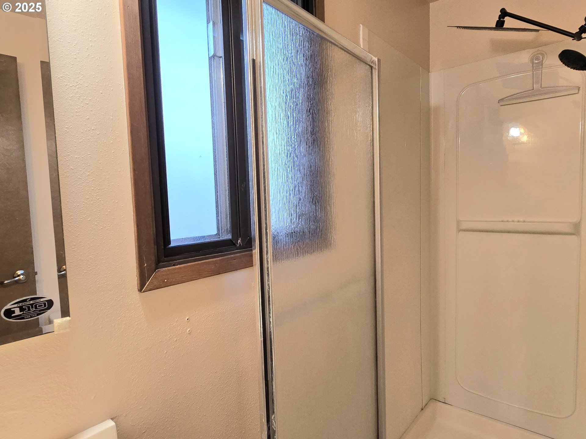 20675 Southwest Rosa Drive Beaverton, OR 97078 - Photo 28 of 40 a bathroom with a glass shower door and a sink