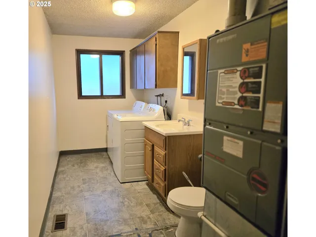 a bathroom with a sink toilet and mirror