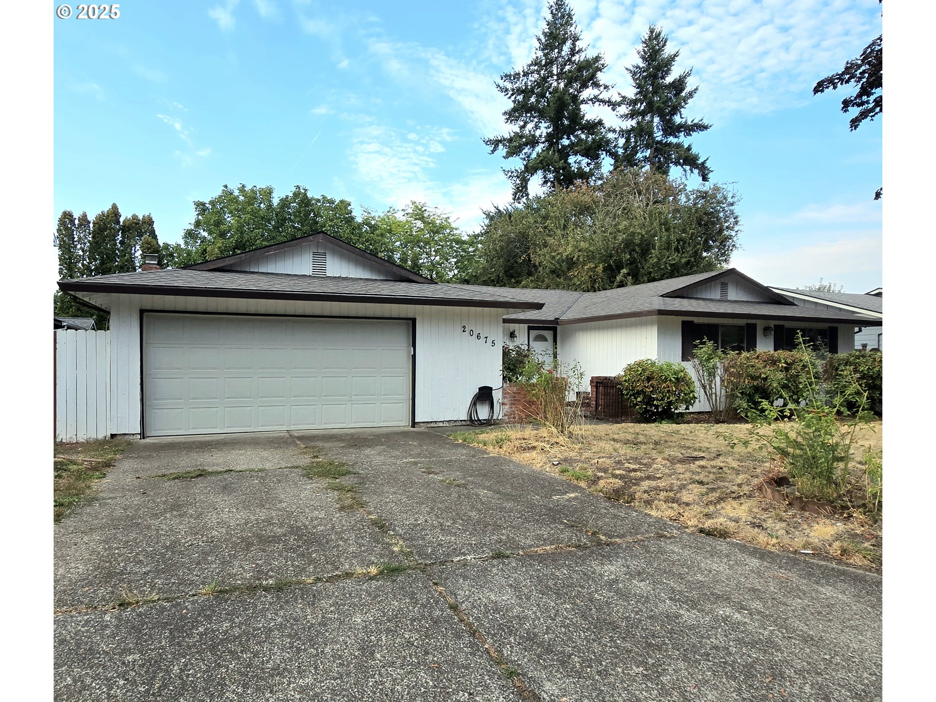20675 Southwest Rosa Drive Beaverton, OR 97078 - Photo 3 of 40 a house with trees in the background