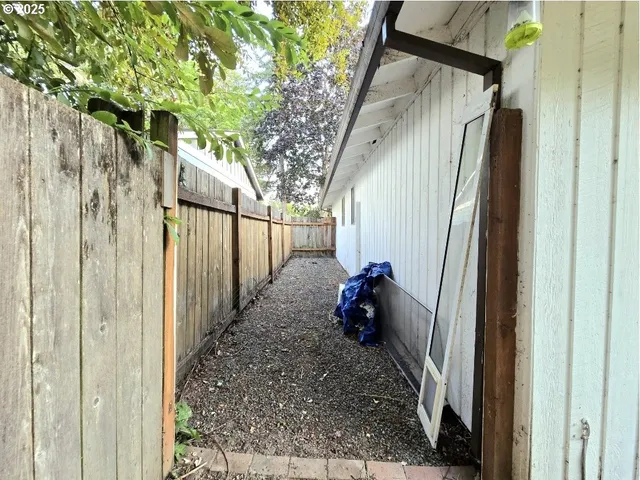 a view of a porch with wooden floor and stairs
