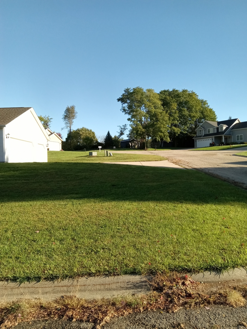 379 Woodside Place Dixon, IL 61021 - Photo 7 of 8 a view of a lake with a house