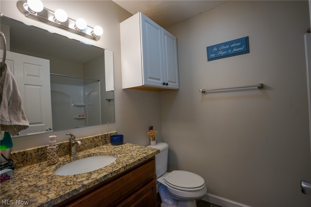 1325 County Line Road Hopewell, OH 43746 - Photo 13 of 45 Bathroom featuring a shower and vanity