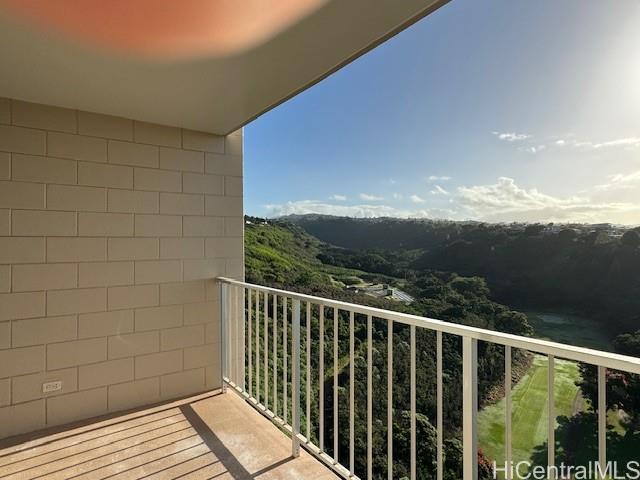 98-707 Iho Place, Unit 1004 Aiea, HI 96701 - Photo 16 of 20 a view of balcony with wooden floor and fence
