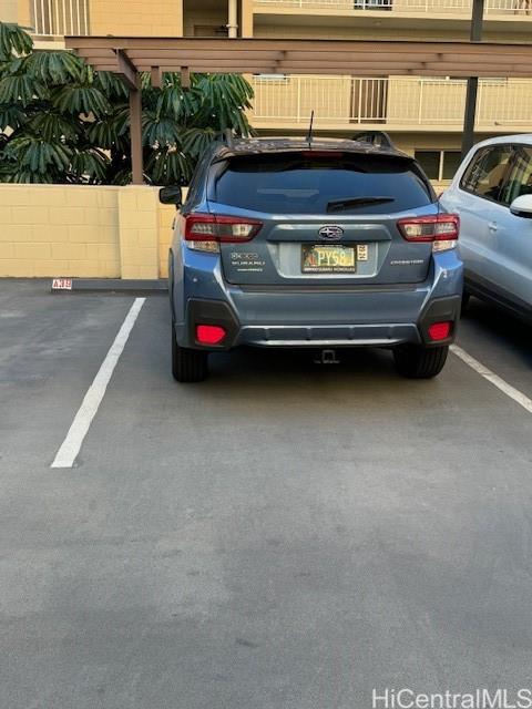 98-707 Iho Place, Unit 1004 Aiea, HI 96701 - Photo 20 of 20 a view of car parked in parking lot