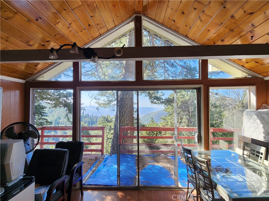 21657 Vista Road Cedarpines Park, CA 92322 - Photo 6 of 39 a view of a dining room with furniture window and outside view