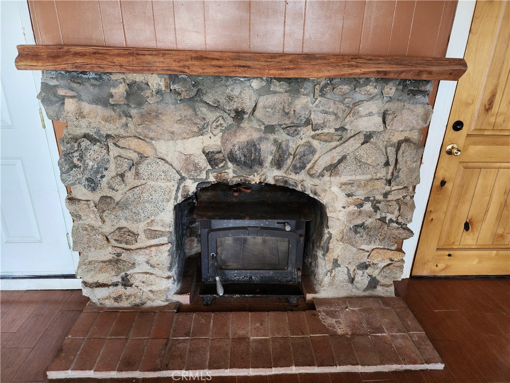 21657 Vista Road Cedarpines Park, CA 92322 - Photo 9 of 39 a view of fireplace with wooden floor