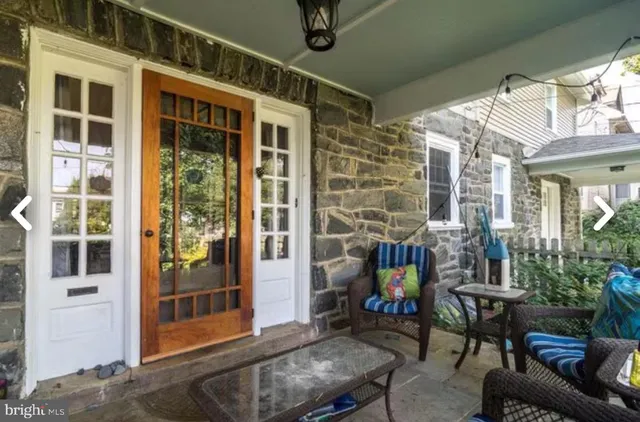 a outdoor living space with patio furniture and potted plants