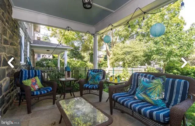 a outdoor living space with furniture and garden view