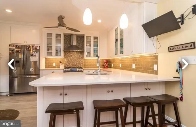a kitchen with a sink cabinets and appliances