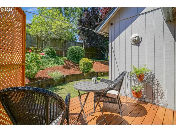 a view of a backyard with potted plants