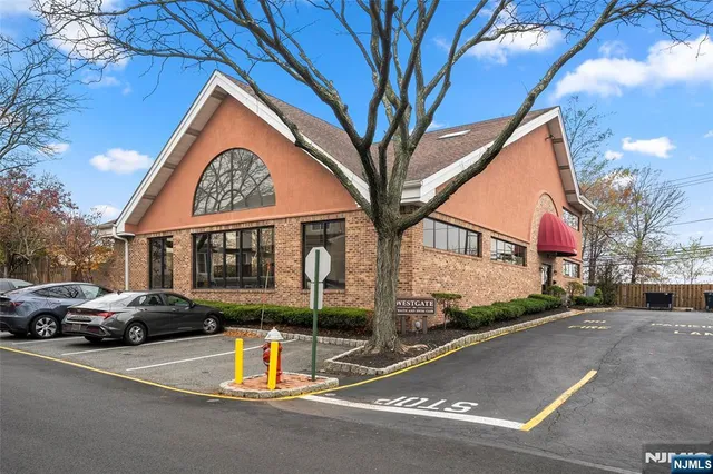 a view of street with parked cars