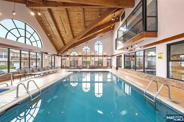 a view of a swimming pool with a balcony