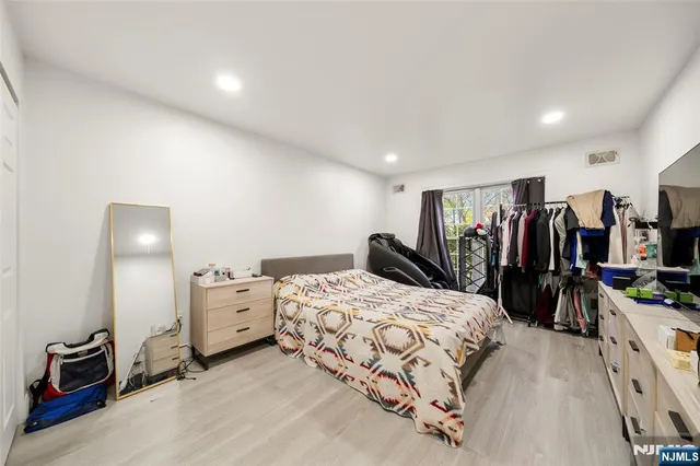 a bedroom with a bed and a walk in closet