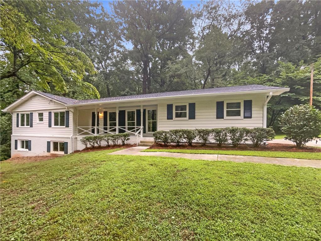 a front view of a house with swimming pool having outdoor seating