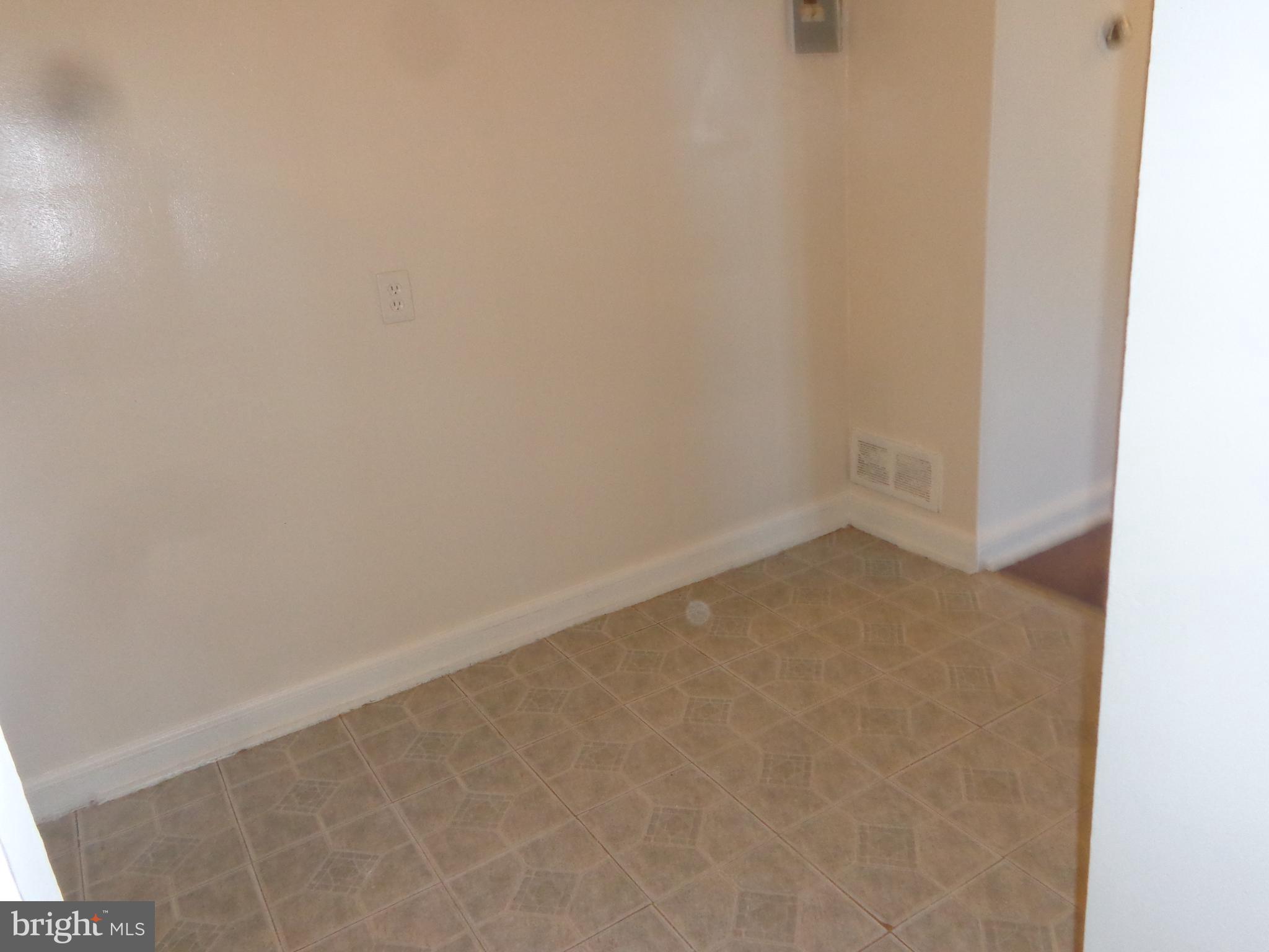 5024 Astor Place Southeast Washington, DC 20019 - Photo 17 of 19 Vacant unit dining area before galley kitchen
