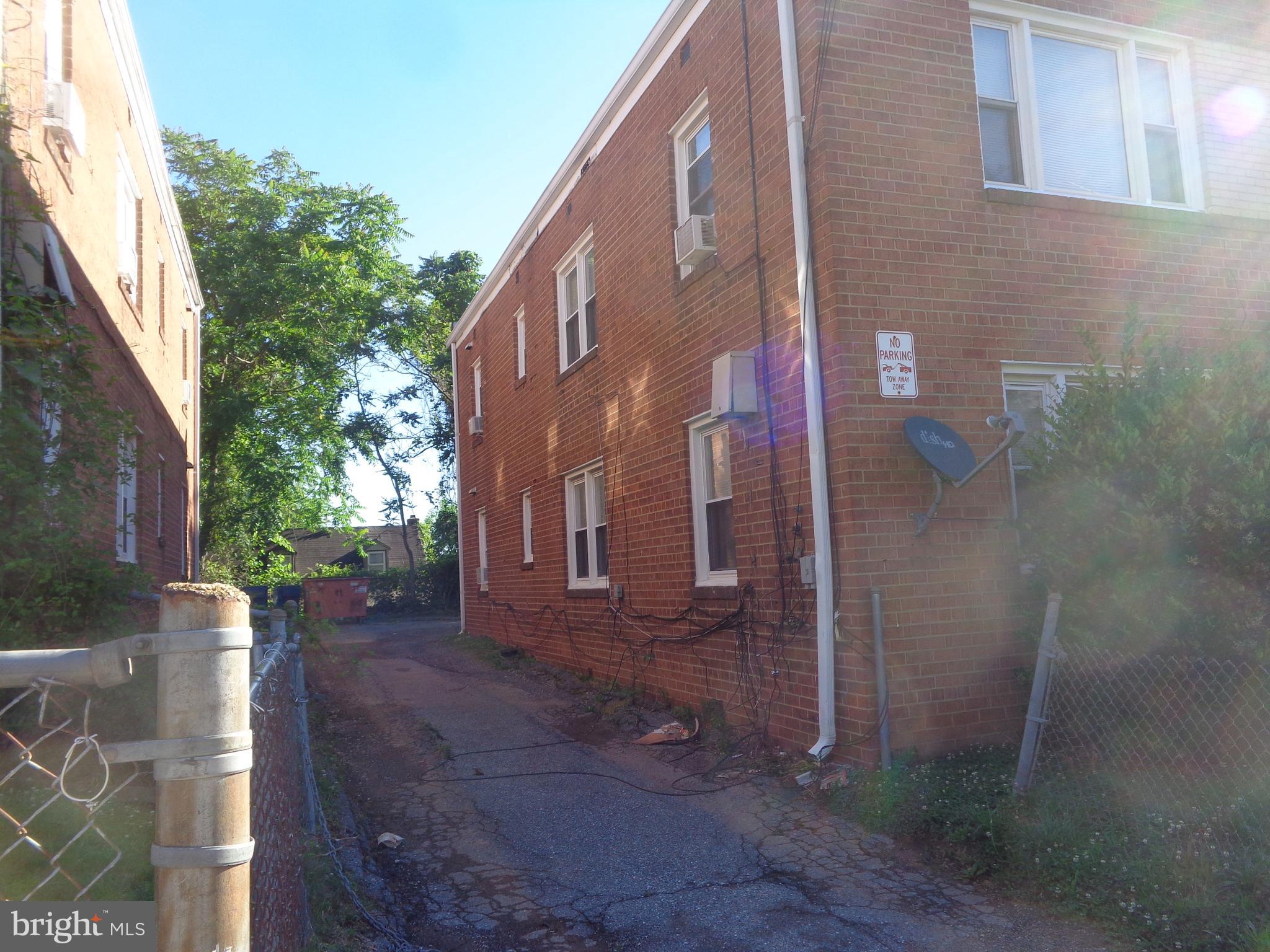 5024 Astor Place Southeast Washington, DC 20019 - Photo 5 of 19 Driveway on left side of bldg.