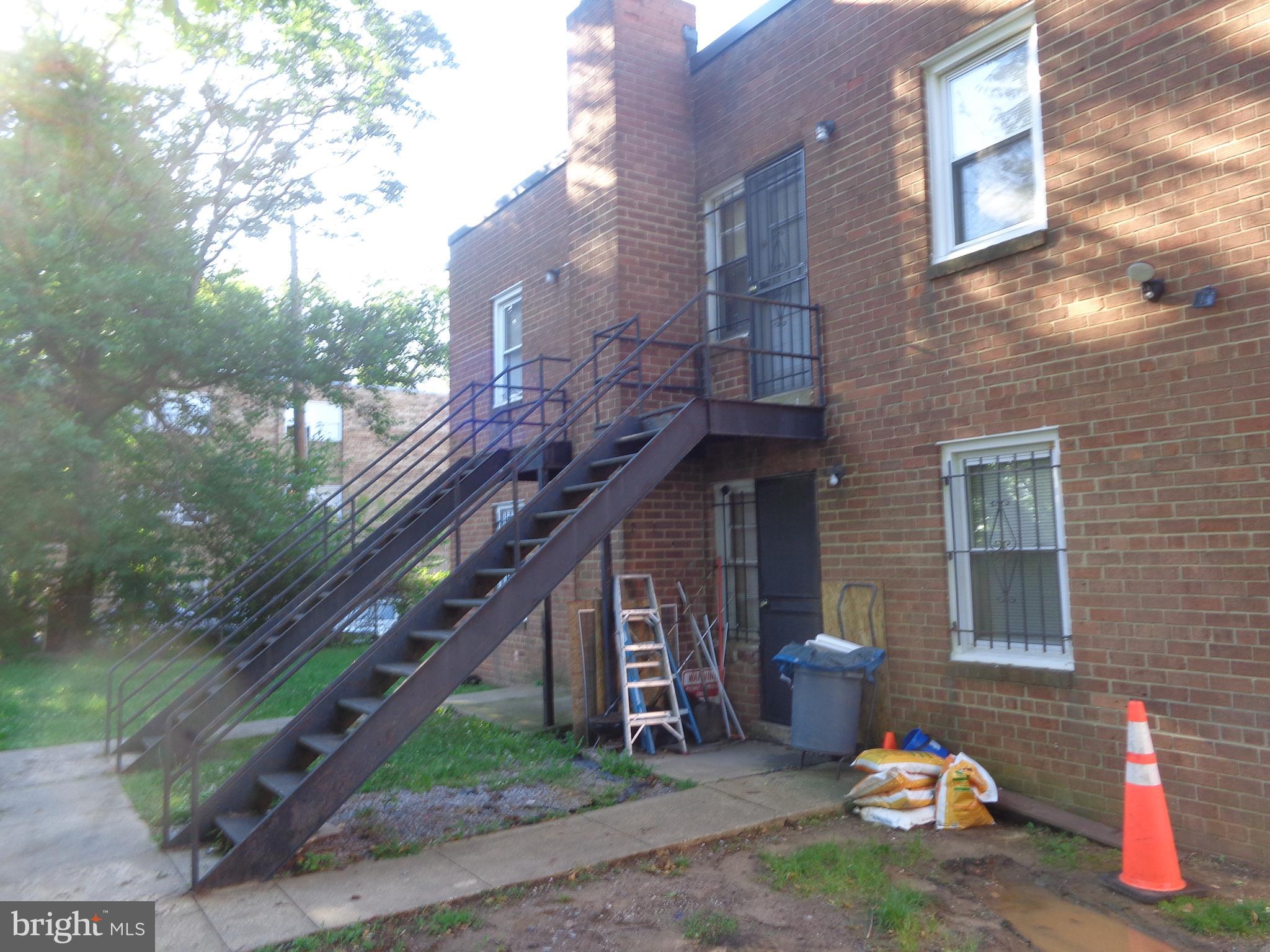 5024 Astor Place Southeast Washington, DC 20019 - Photo 8 of 19 Rear of bldg with second floor rear steps