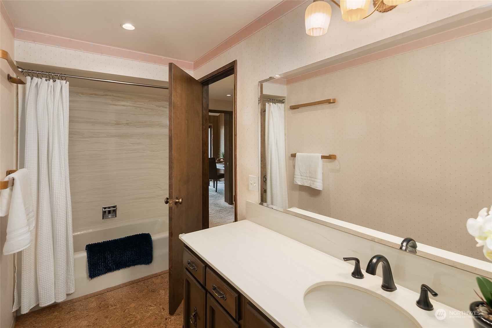 5300 Butterworth Road Mercer Island, WA 98040 - Photo 29 of 36 a bathroom with a sink and a mirror